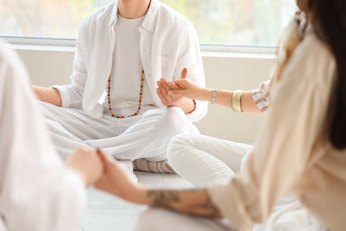A small group sitting together in meditation