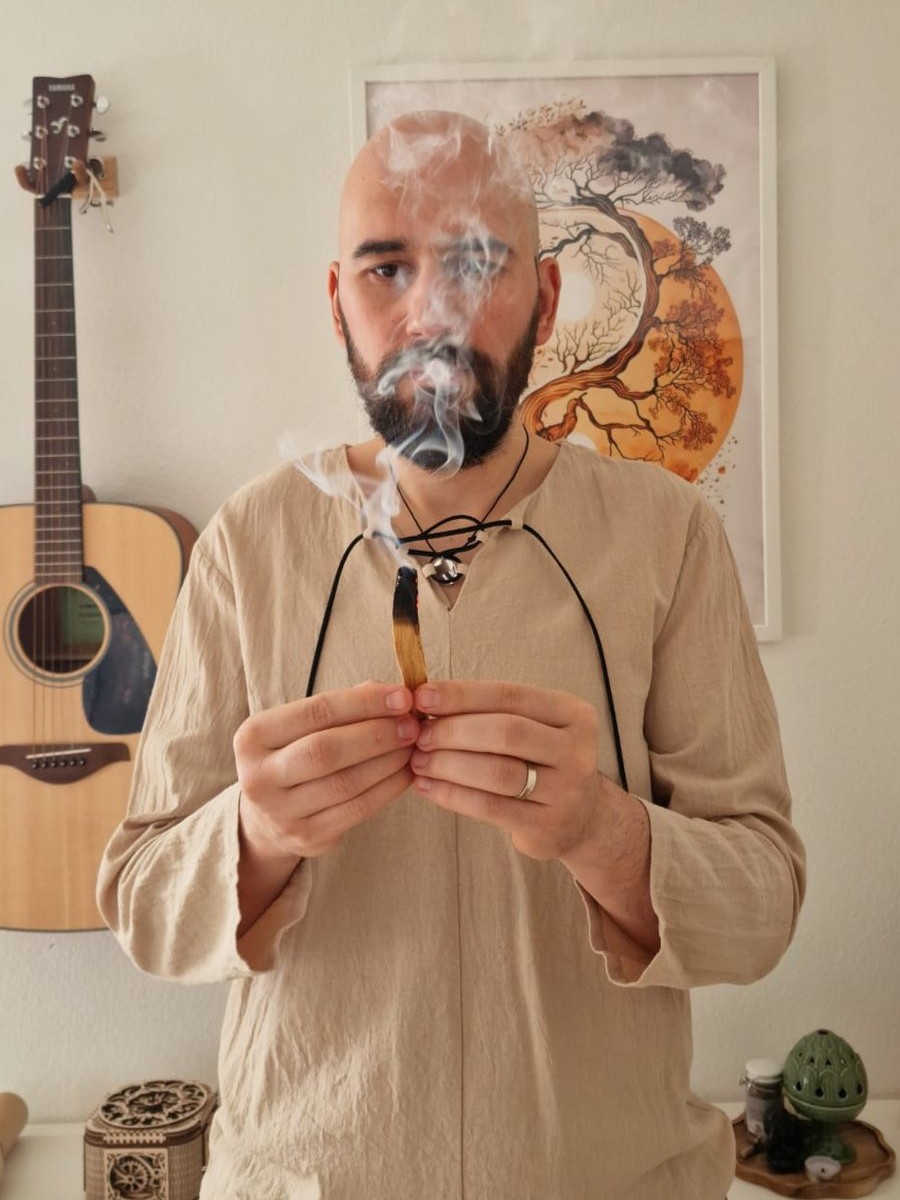Flavius holding palo santo
